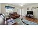Cozy living room with wood floors, seating, and a window view to the front yard at 773 Sir Raleigh Dr, Concord, NC 28025