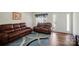 Comfortable living room with hardwood floors, a cozy rug and modern furnishings at 773 Sir Raleigh Dr, Concord, NC 28025