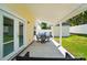 Covered patio with seating area, overlooking fenced yard and a shed in the backyard at 773 Sir Raleigh Dr, Concord, NC 28025