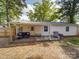 A cozy back deck with patio furniture and a grill, perfect for outdoor entertaining at 8475 Nc 49 N Hwy, Mount Pleasant, NC 28124