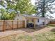 Fenced in backyard with a back deck, a privacy fence, and a storage shed at 8475 Nc 49 N Hwy, Mount Pleasant, NC 28124