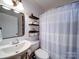 Charming bathroom with a pedestal sink, neutral paint, and a stylish shower curtain for a relaxing atmosphere at 8475 Nc 49 N Hwy, Mount Pleasant, NC 28124