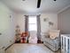 Bedroom featuring hardwood floors, fresh paint, chair, and custom bookshelves at 8475 Nc 49 N Hwy, Mount Pleasant, NC 28124