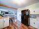 Bright kitchen features white cabinets, stainless appliances, butcher block countertops and flows into the living room at 8475 Nc 49 N Hwy, Mount Pleasant, NC 28124