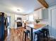 Updated kitchen boasts white cabinetry, stainless steel appliances, and butcher block counters with a breakfast bar at 8475 Nc 49 N Hwy, Mount Pleasant, NC 28124