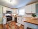 Bright kitchen features stainless steel appliances, subway tile backsplash, and butcher block countertops for a modern feel at 8475 Nc 49 N Hwy, Mount Pleasant, NC 28124