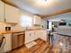 Bright kitchen features white cabinets, stainless steel appliances, butcher block countertops, and an eat-in bar area at 8475 Nc 49 N Hwy, Mount Pleasant, NC 28124