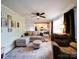 Bright living room features an open layout, wood floors, a comfortable sofa, and abundant natural light at 8475 Nc 49 N Hwy, Mount Pleasant, NC 28124