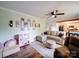 Inviting living area with a sectional sofa, play kitchen, and wood-look floors, perfect for Gathering time at 8475 Nc 49 N Hwy, Mount Pleasant, NC 28124