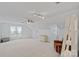 Spacious bonus room with neutral carpet, a ceiling fan, and plenty of natural light at 8651 Walsham Dr, Charlotte, NC 28277