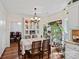 Dining area with large windows and a view of greenery at 8651 Walsham Dr, Charlotte, NC 28277