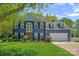 Charming two-story home with a well-manicured lawn, a two car garage, and inviting front porch at 8651 Walsham Dr, Charlotte, NC 28277