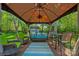 Covered outdoor gazebo, perfect for entertaining, with comfortable seating and tranquil views at 8651 Walsham Dr, Charlotte, NC 28277