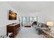 Bright and airy living room featuring hardwood floors, a large rug, and modern decor at 8651 Walsham Dr, Charlotte, NC 28277