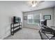 Study with a ceiling fan, a window, a desk, and a modern-style shelving unit at 901 Heritage Pkwy, Fort Mill, SC 29715