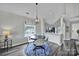 Bright dining space featuring a stylish chandelier, and seamlessly connected with open kitchen for easy entertaining at 901 Heritage Pkwy, Fort Mill, SC 29715