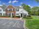 Charming townhome featuring brick and vinyl siding, black shutters, and manicured landscaping for great curb appeal at 901 Heritage Pkwy, Fort Mill, SC 29715