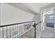 Hallway landing with views of the lower level, staircase, and bedroom entry at 901 Heritage Pkwy, Fort Mill, SC 29715