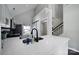 Contemporary kitchen featuring sleek quartz countertops, modern fixtures, and an open design with views at 901 Heritage Pkwy, Fort Mill, SC 29715