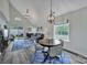 Inviting living area with vaulted ceilings, a round dining table and sliding glass door with backyard access at 901 Heritage Pkwy, Fort Mill, SC 29715
