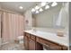Functional bathroom with a vanity, sink, and shower featuring a neutral color palette at 985 Angelica Ln, Tega Cay, SC 29708