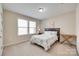 Bright bedroom with a cozy bed, side table, and windows providing natural light at 985 Angelica Ln, Tega Cay, SC 29708
