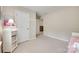 This cozy bedroom features a daybed and side table with ample natural light at 985 Angelica Ln, Tega Cay, SC 29708