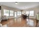 Inviting dining area with wood floors, bright windows, and a table perfect for gatherings at 985 Angelica Ln, Tega Cay, SC 29708