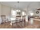 Elegant dining room with hardwood floors and views into the living room at 985 Angelica Ln, Tega Cay, SC 29708