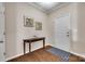 Elegant entryway with hardwood floors, console table, and decorative artwork at 985 Angelica Ln, Tega Cay, SC 29708