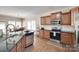 Bright kitchen with granite countertops, stainless appliances, and breakfast nook at 985 Angelica Ln, Tega Cay, SC 29708