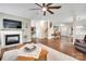 Open living area with hardwood floors, fireplace, and seamless flow to other rooms at 985 Angelica Ln, Tega Cay, SC 29708