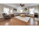 Spacious living room featuring hardwood floors, plush seating, and natural light at 985 Angelica Ln, Tega Cay, SC 29708