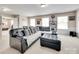 Comfortable living room showcases a large sectional sofa with pillows, perfect for relaxation at 985 Angelica Ln, Tega Cay, SC 29708
