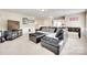 Spacious living room featuring a large leather sectional sofa and entertainment center at 985 Angelica Ln, Tega Cay, SC 29708