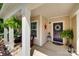 Inviting front porch with seating, lush plants, and a decorative wreath at 985 Angelica Ln, Tega Cay, SC 29708