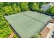 Aerial view of community tennis courts surrounded by mature trees and fencing at 985 Angelica Ln, Tega Cay, SC 29708