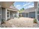 Backyard featuring a patio, screened-in porch, and meticulous landscaping for outdoor living and entertaining at 1008 Avalon Pl, Matthews, NC 28104