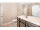 Bathroom features vanity with a sink and dark wood cabinets, as well as a shower/tub at 1008 Avalon Pl, Matthews, NC 28104
