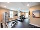 Well-equipped gym featuring modern exercise equipment and ample natural light for a healthy lifestyle at 1008 Avalon Pl, Matthews, NC 28104