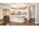 Bright kitchen with stainless steel appliances, quartz countertops, ample cabinet space, and an open layout at 1008 Avalon Pl, Matthews, NC 28104