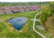 Scenic view of the pond and walking path nestled within the well-maintained community at 1008 Avalon Pl, Matthews, NC 28104