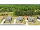 Aerial view of a beautiful home with a spacious backyard, playground, and lush greenery at 1052 Harlow'S Crossing Dr, Weddington, NC 28104