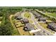 An aerial view showcases the neighborhood's well-maintained lawns and picturesque street layout at 1052 Harlow'S Crossing Dr, Weddington, NC 28104