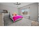 Bright bedroom featuring a cozy bed, window, and neutral decor, creating a relaxing atmosphere at 1052 Harlow'S Crossing Dr, Weddington, NC 28104