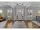 Elegant foyer with hardwood floors, white trim, and abundant natural light at 1052 Harlow'S Crossing Dr, Weddington, NC 28104