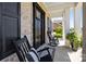 Charming front porch with comfortable rocking chairs and a well-decorated entrance at 1052 Harlow'S Crossing Dr, Weddington, NC 28104