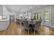 Bright kitchen and dining area with a large island, stainless steel appliances, and ample natural light at 1052 Harlow'S Crossing Dr, Weddington, NC 28104