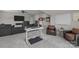Comfortable living room with a functional computer desk and chair setup, creating a versatile workspace at 1052 Harlow'S Crossing Dr, Weddington, NC 28104