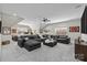 Spacious living room with a large sectional sofa, offering a comfortable space for relaxation and entertainment at 1052 Harlow'S Crossing Dr, Weddington, NC 28104